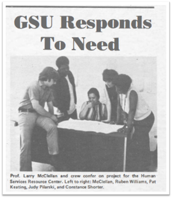 Larry McClellan and crew confer on project for the Human Resource Center